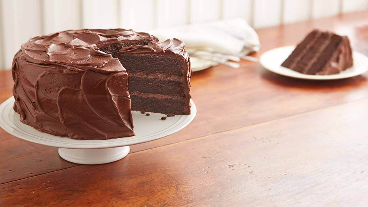 freshly made hersheys perfectly chocolate chocolate cake on cake stand