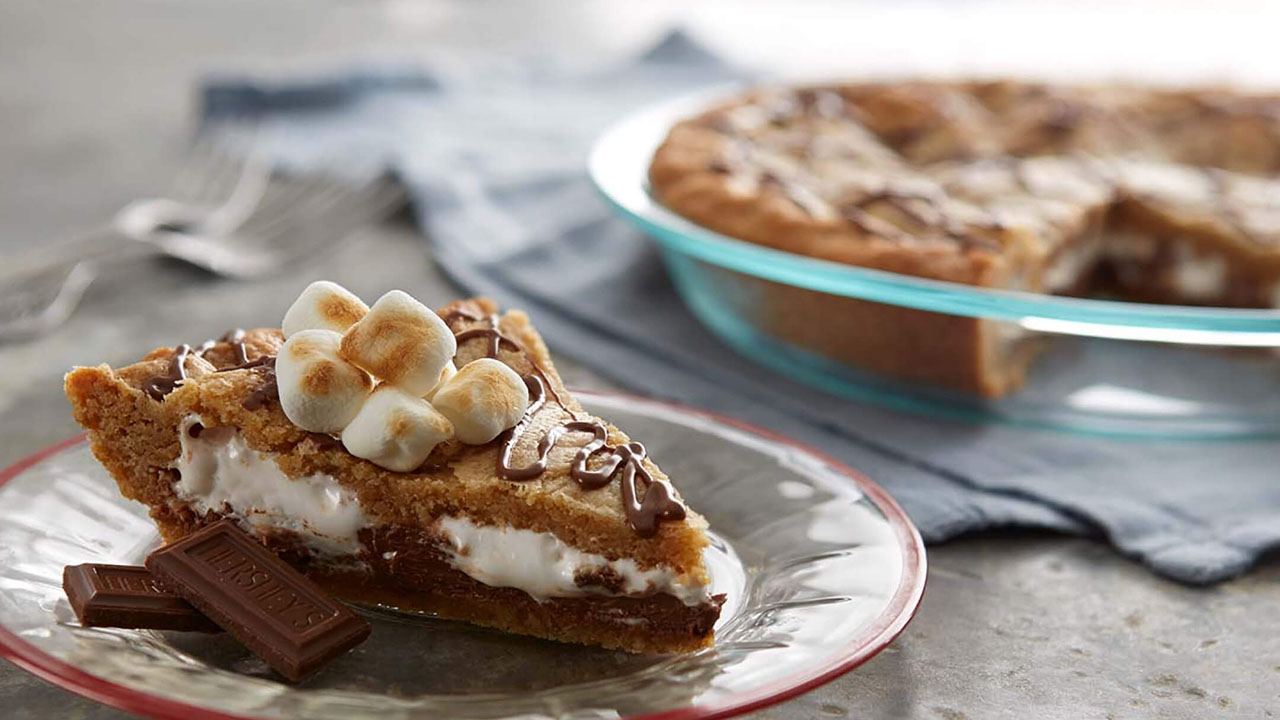 slice of hersheys smores blondie pie on a serving dish