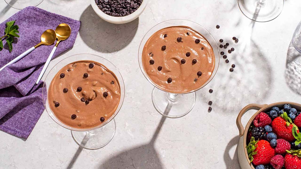 two glasses filled with easy frozen chocolate mousse