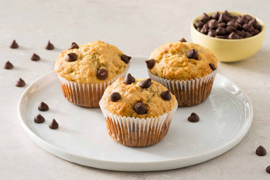 plate of freshly baked buttermilk chocolate chip muffins